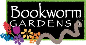 Illustrated logo of the words "Bookworm Gardens" in white against a black background, surrounded by a green border with multi colored flowers and a worm in the foreground.
