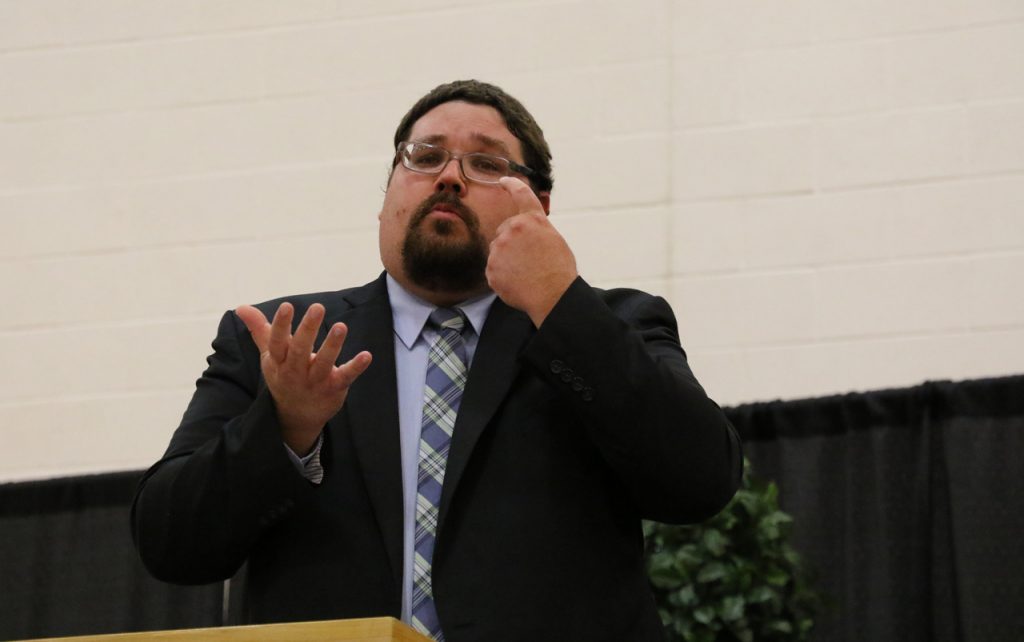 Principal Brian Lievens presenting at high school graduation.