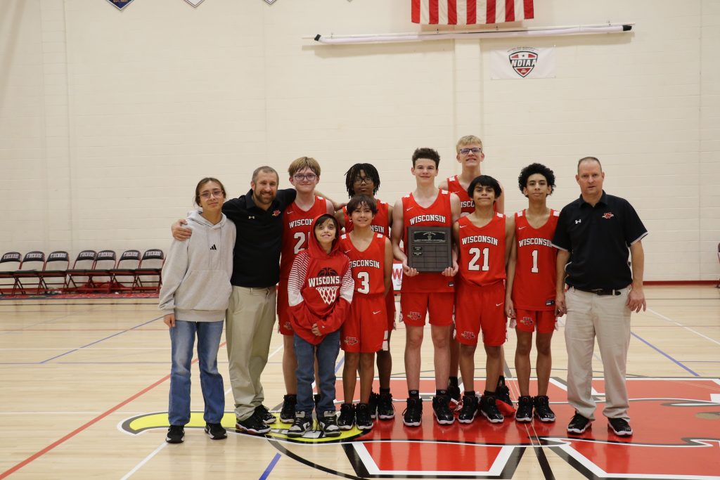 WSD Boys Basketball Team photo after winning the Neesam Classic Champions with brown plaque.